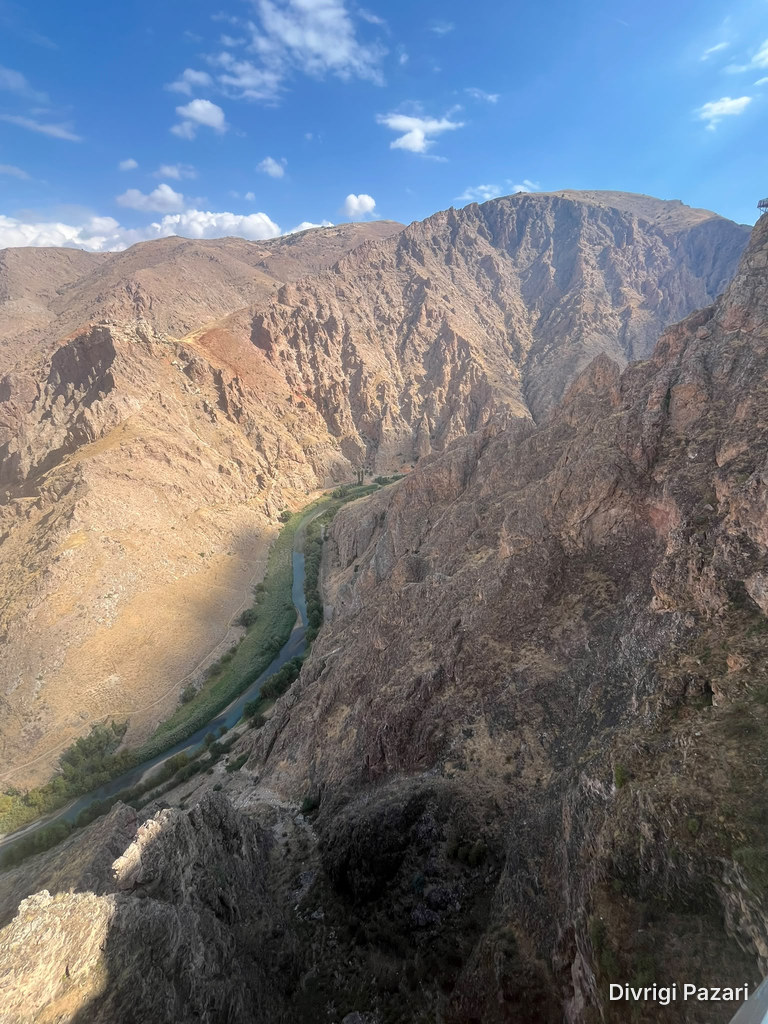 The Çaltı flowing between steep rocky slopes, with green along its banks