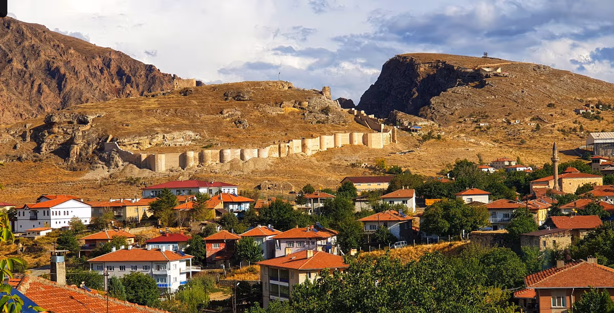 Wide view of Divriği Castle, the opposite rise, walls and settlement