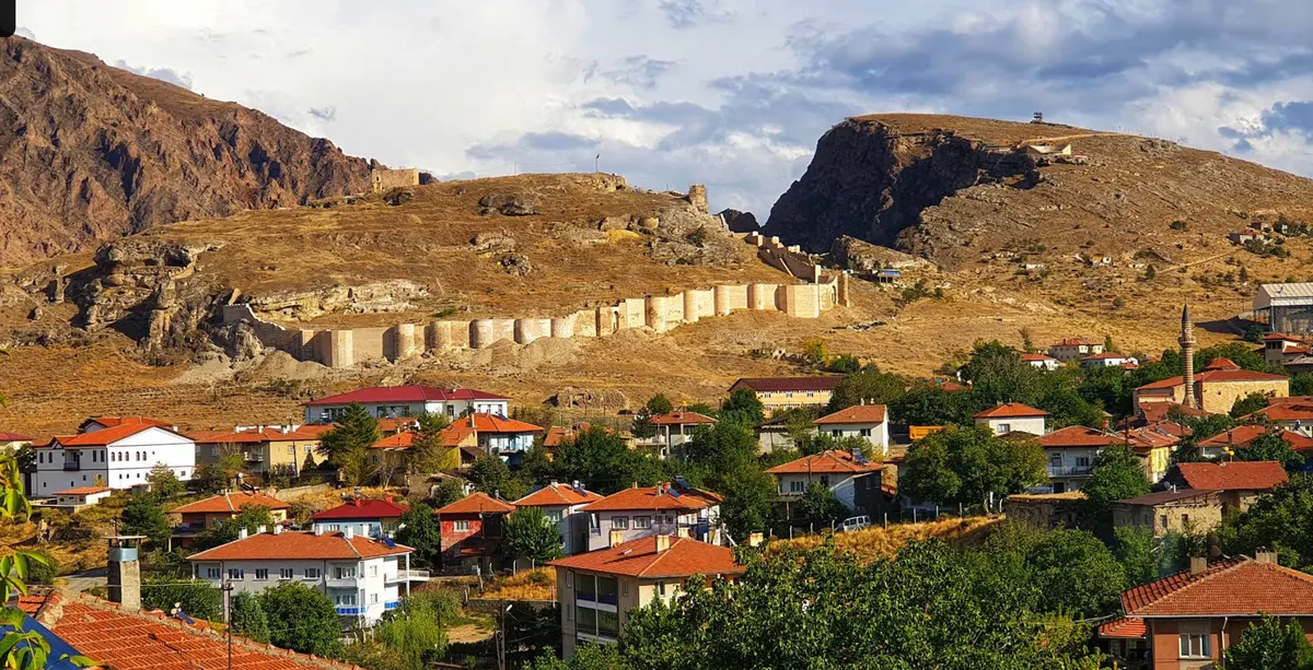 Wide view of Divriği Castle, the opposite rise, walls and settlement